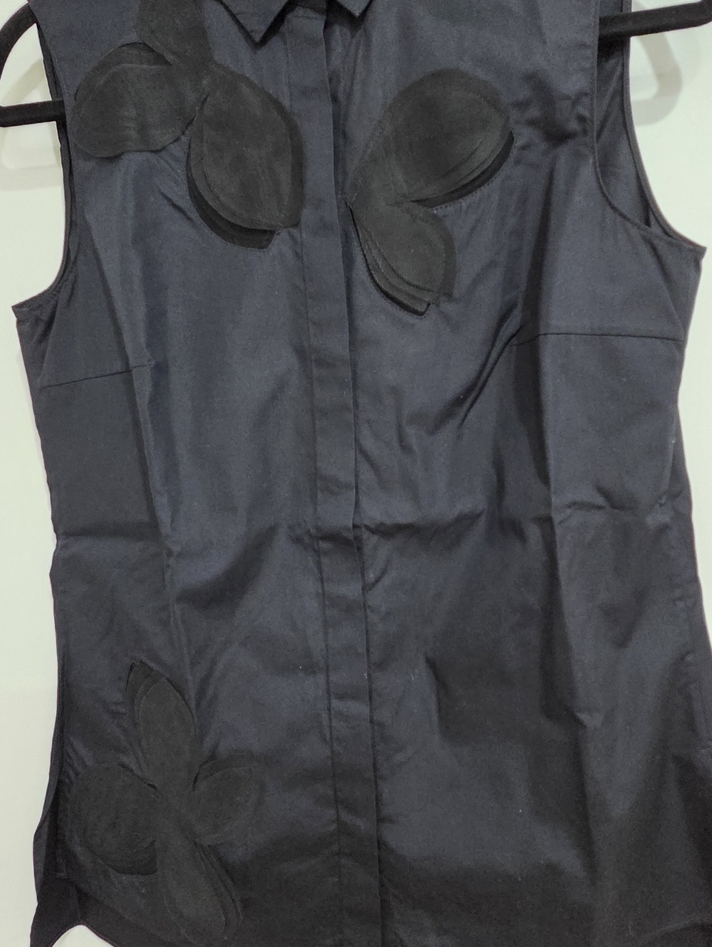 Sleeveless Black Blouse with Petal Appliqués